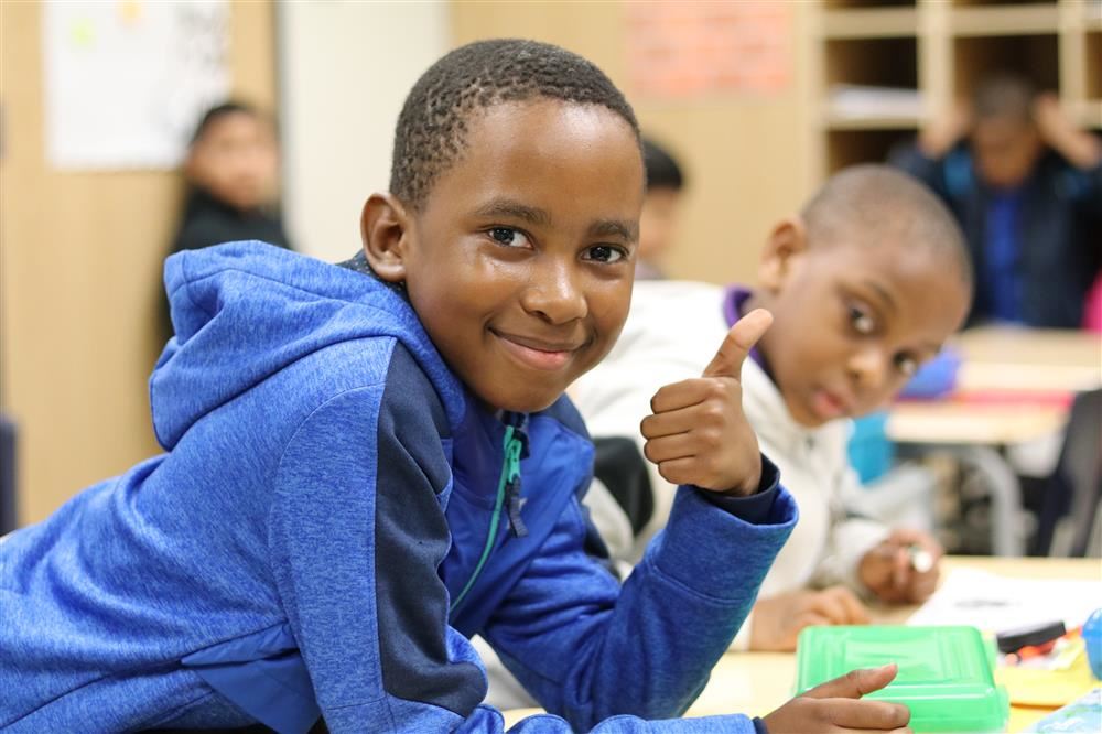 Thumbs up from a student