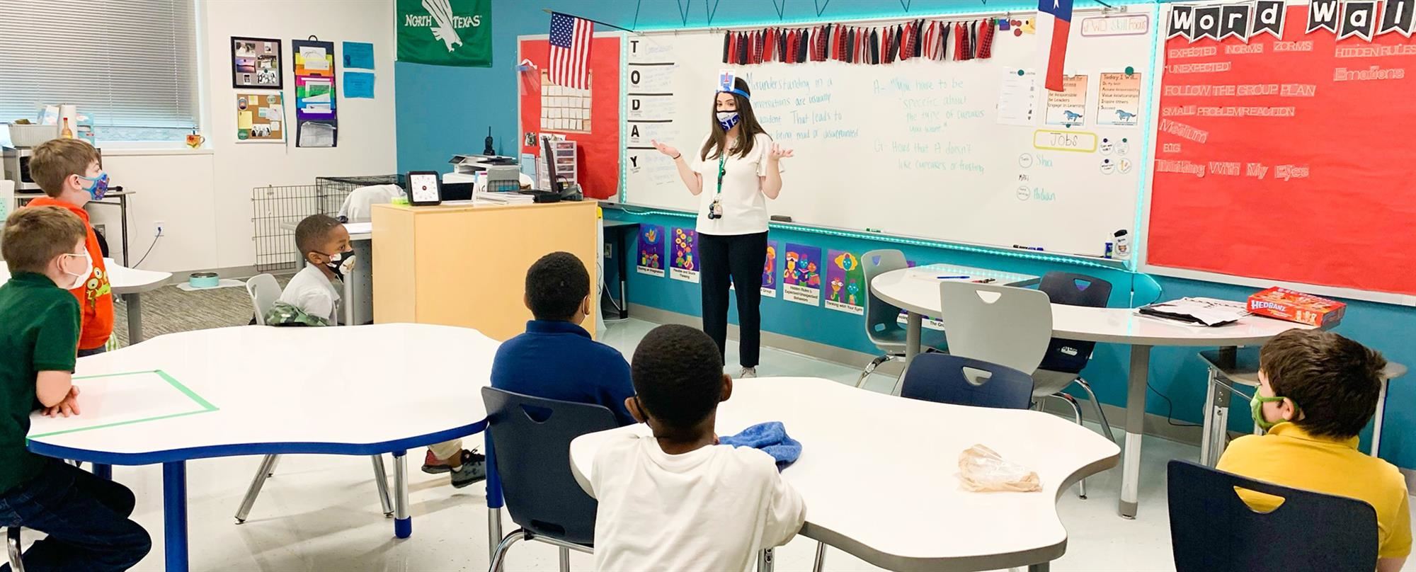 teacher teaching students in a classroom