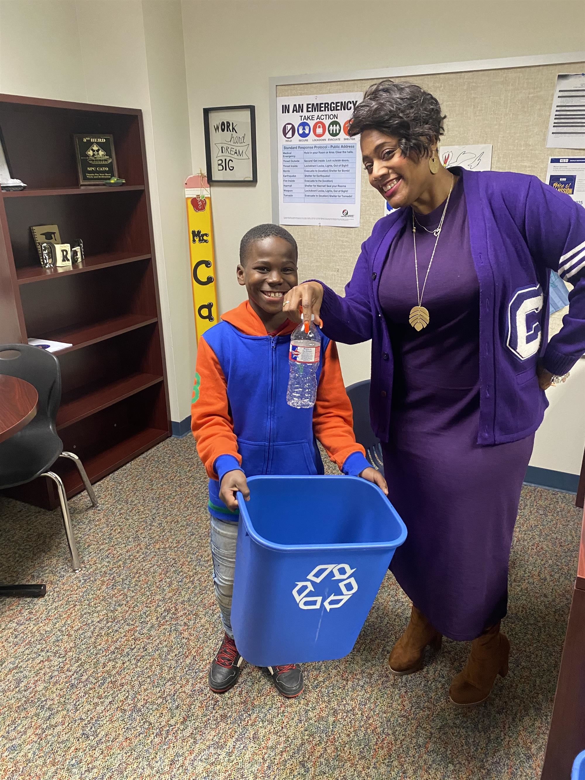 David L. Walker students with principal picking up trash