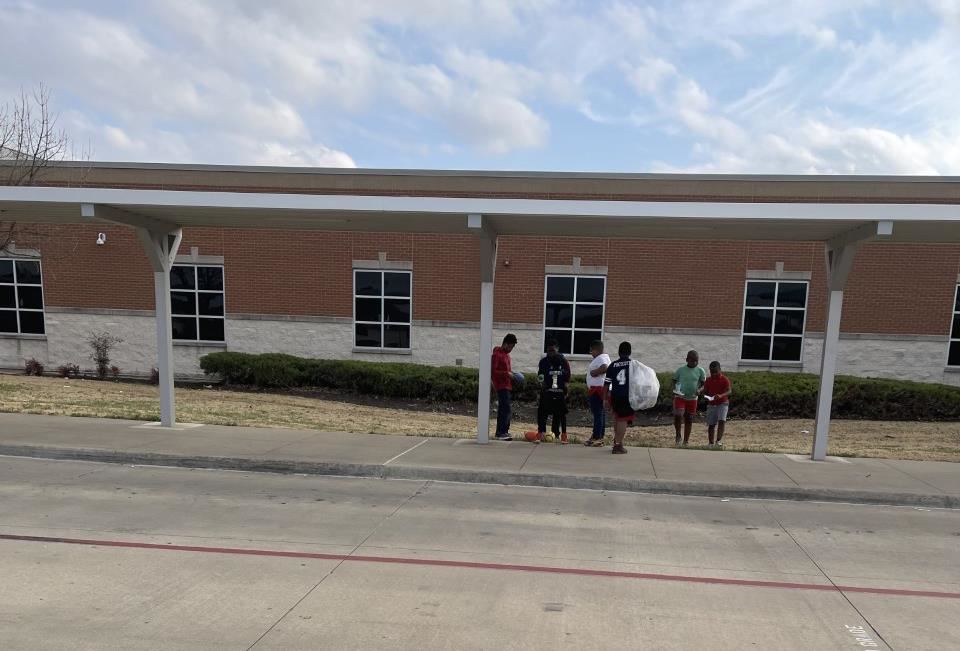 Mary Harris Elementary students picking up trash around the school