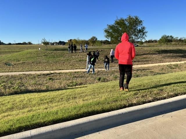 Bill R. Johnson CTE students picking up trash outside of the CTE Center. 