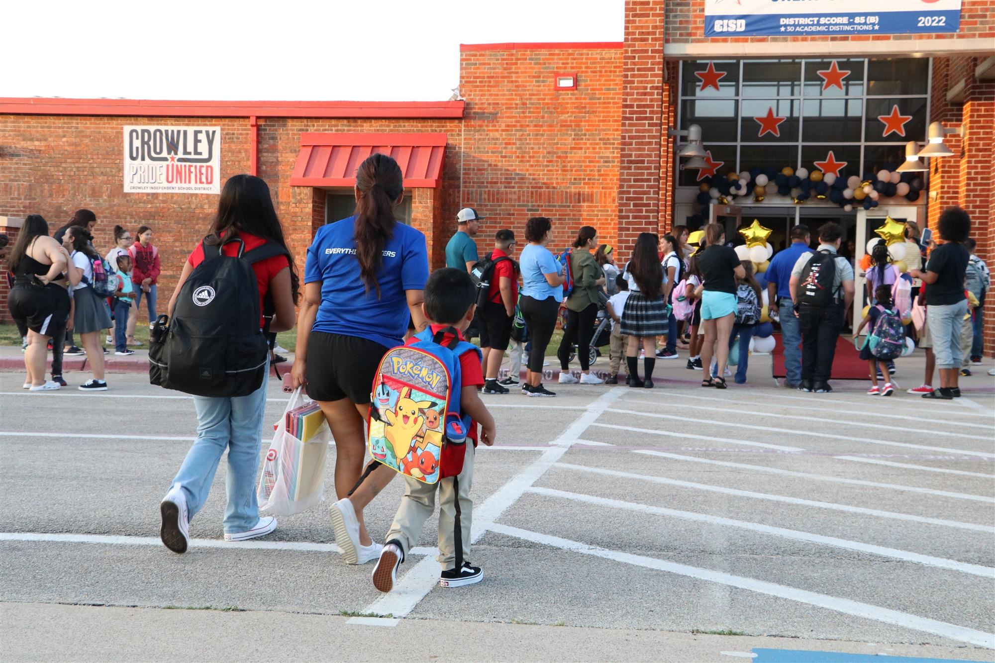 Parent walking students to school