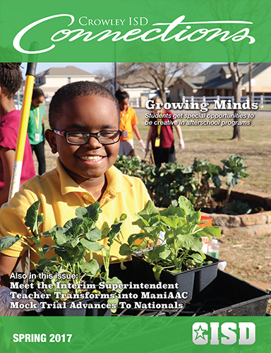 2017 Spring Issue - Young man in yellow shirt holding flowers 