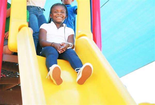 Sy'Mora Kindred sliding down a slide