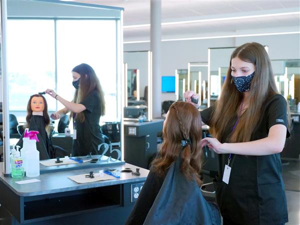 Ava Tinsley cutting hair