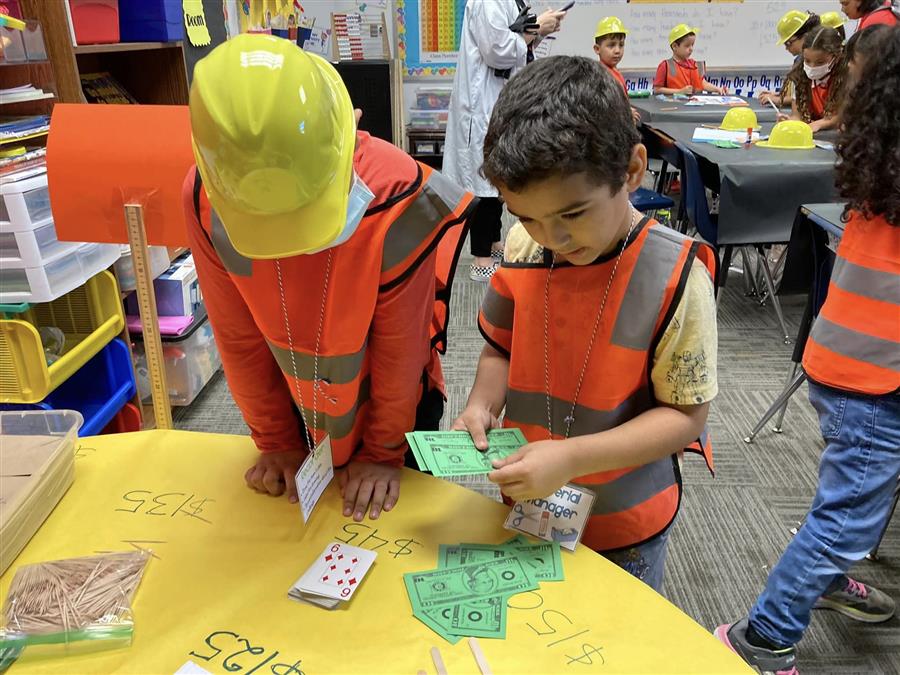 Students handing in money