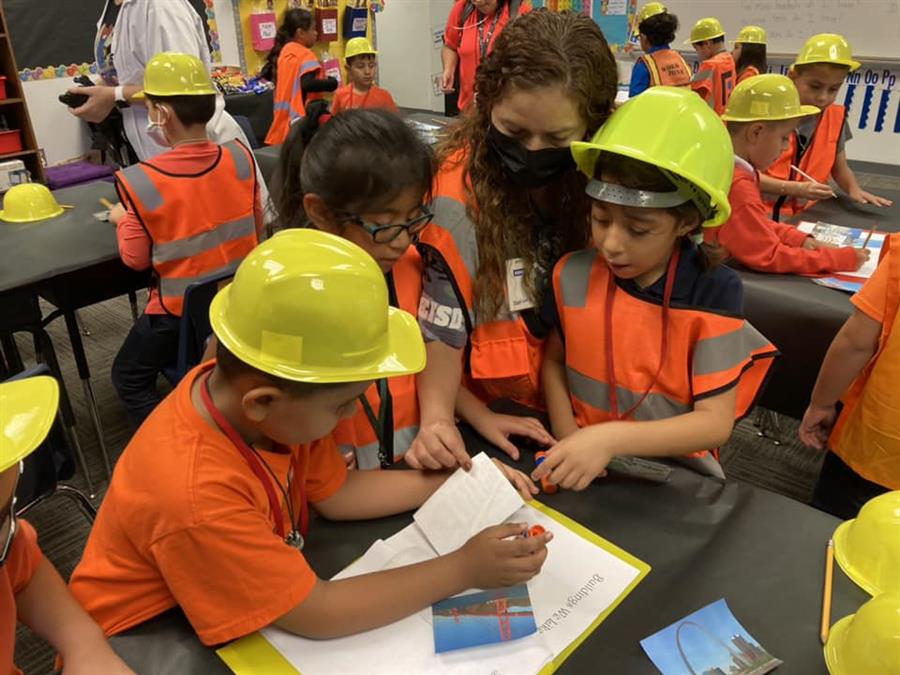 Students working in hardhats 